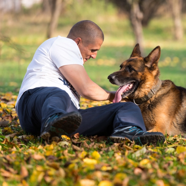 Man with a dog in park.